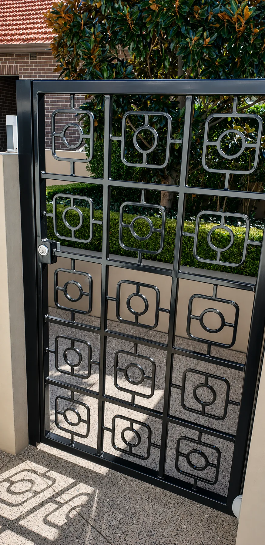 Decorative wrought-iron gate with geometric square panels.